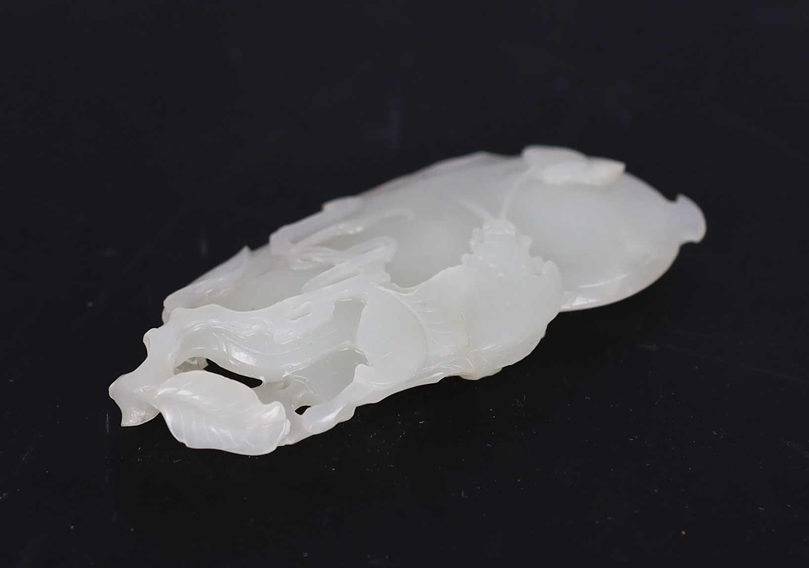 A Chinese white jade pendant, carved as a gourd, Qianlong period